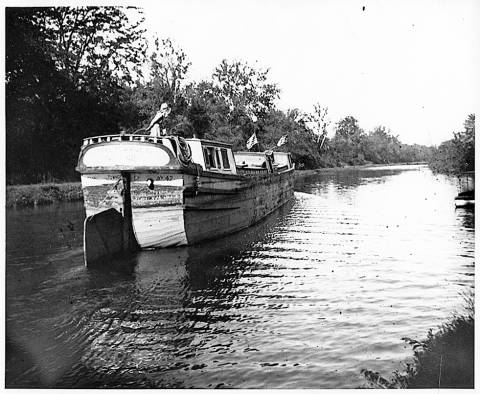 light (empty) boat heading back up the canal 