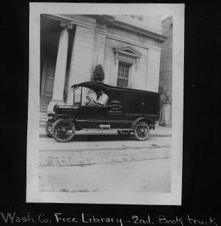 Book wagon parked outside of Washington County Free Library on Summit Avenue