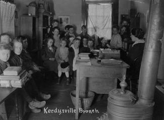 Group of children inside of Keedysville book deposit station