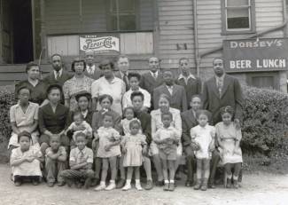 Photo of multiple families standing for picture outside of Dorsey's circa ?