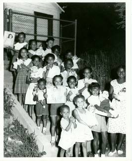 Children pose for picture on stairs outside of Pine Avenue circa ?