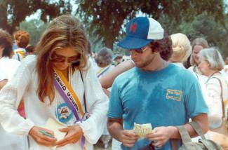 Gloria Steinem provides her signature to Al Feldstein