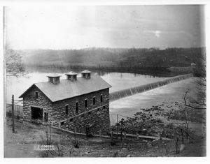 Black & White photo of Potomac river and canal with building near canal