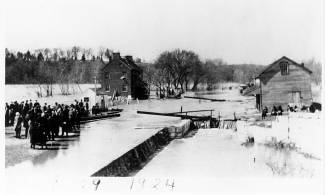 The flood of 1924, onlookers watching the flooded Potomac River at Lock 38