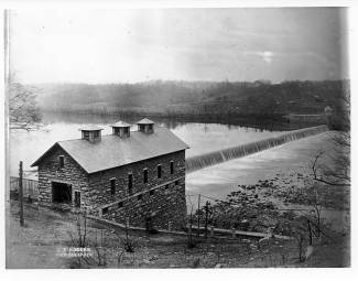 Dam 4;a large stone building at the end of embankment 