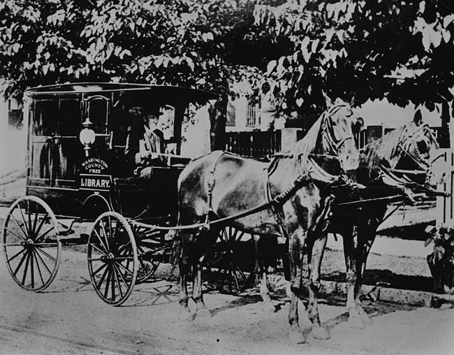 book wagon pulled by 2 horses