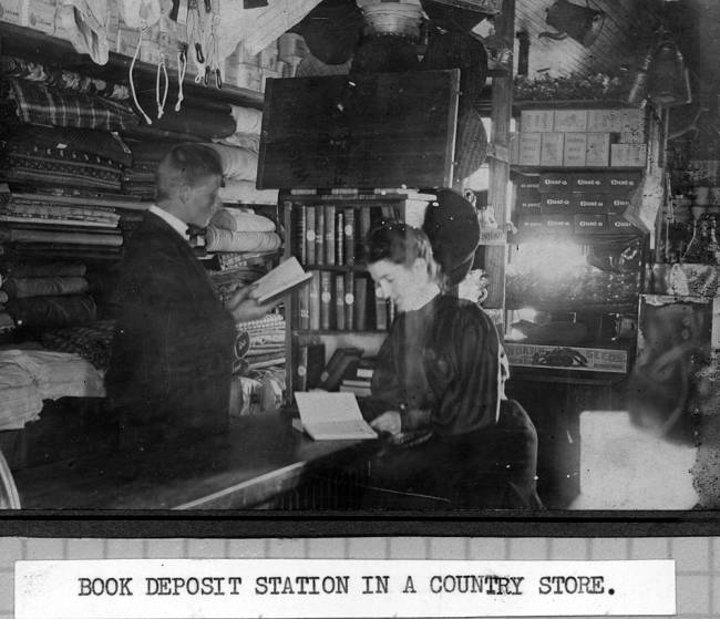 Photo of book deposit in country store; man and woman reading books