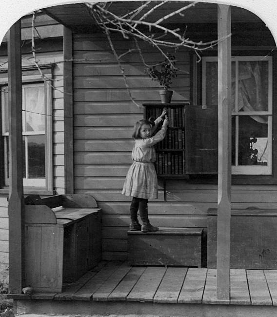Young girl looking through brooks on a porch