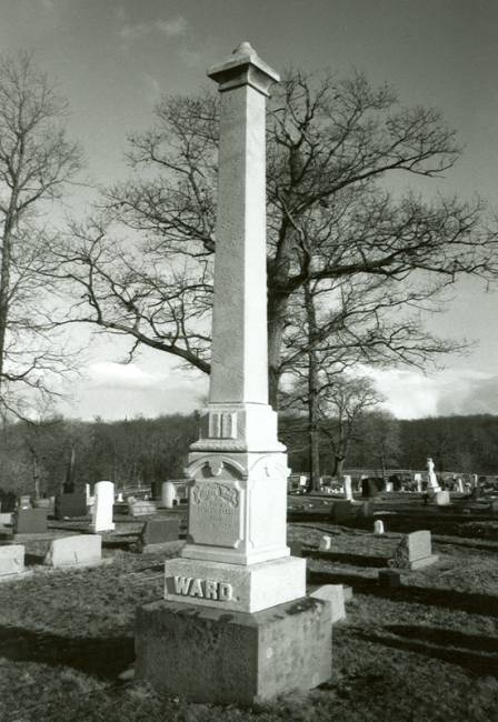 Grave marker like obelisk with Ward written at bottom in cemetery
