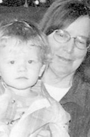 Photo of Barbara Angle holding small child