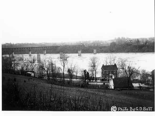 Lock 38 area, bridge missing from flood; train bridge in background