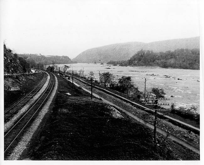 downstream at Sandy Hook, train tracks run parallel to canal