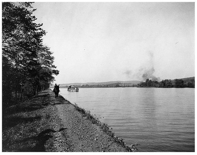 low-lying area beside the river called Big Pool; Boat being pulled by mule and rider with rope on tow path