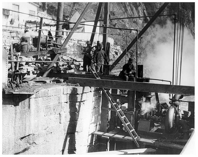 Workers, beams and brick wall during Lock 33 reconstruction, circa 1930s