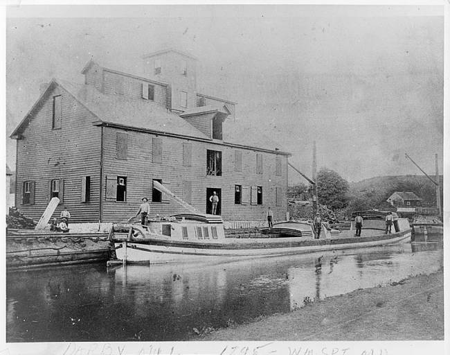 Darby's Mill, near Lock 44, by Williamsport, MD; workers are busy throughout, circa 1895