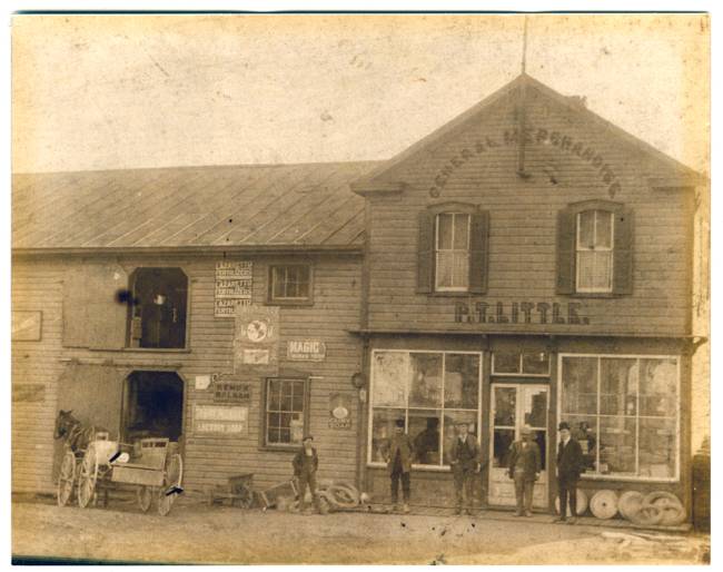 P.T. Little's store at Hancock; several men standing outside store with a horse and wagon 