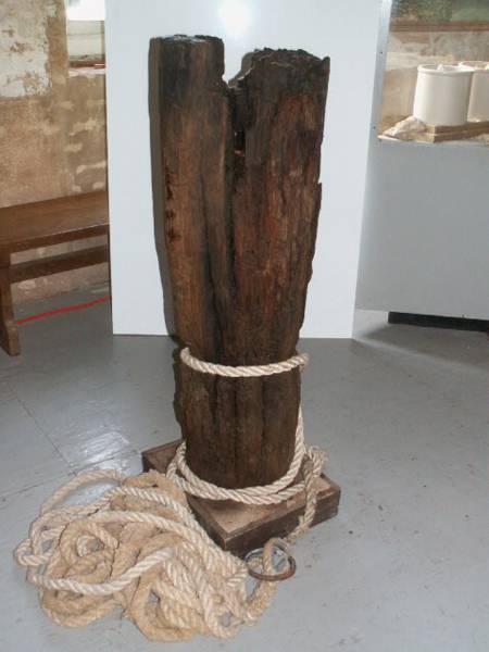 A snubbing post acts as a brake for boats locking through the canal with rope tied around it