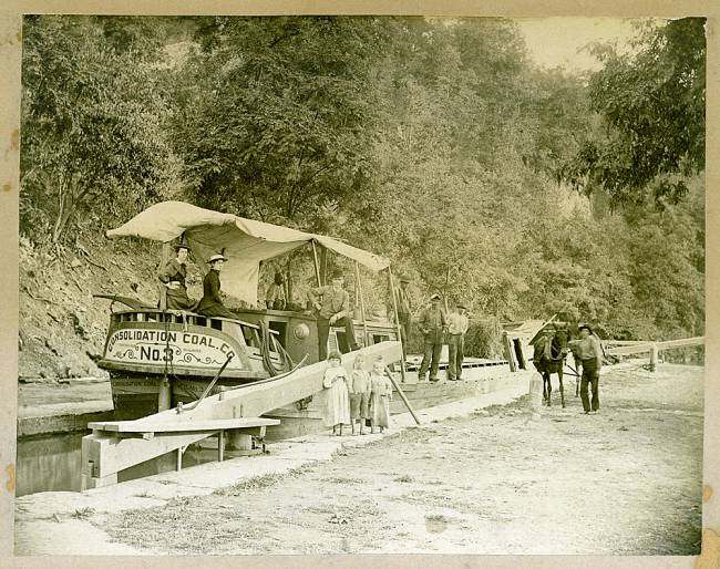 Consolidated Coal Co No. 3 Canal boat with family and multiple people standing around; circa 1902