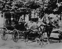 book wagon pulled by 2 horses