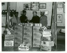 3 members of Fulton Myers Post #153 make a donation of canned goods to the Salvation Army 1962