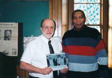 2 men pose for photo during Black History Month 2004