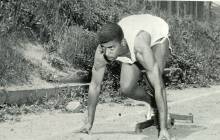 Photo of runner in start position for race from 1966