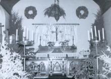 Image of church altar with 2 candelabras on each side