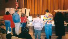 Students gather in hall to view items from Black History Month at Allegany College