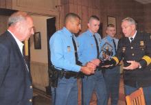 Police officers are congratulated for awards