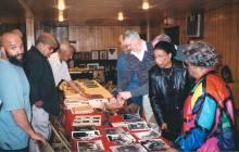 People gathered viewing items from Black History display at Fulton Myers Post #153