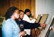 2 people viewing MLK exhibit at Frostburg State University 2004