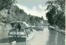 Colorized postcard of boat on C&O Canal