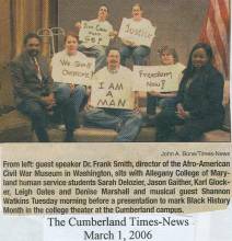 Students at Allegany College hold signs for photo from Black History Month