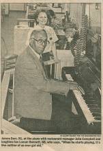 Newspaper clipping of man playing piano with woman standing in background