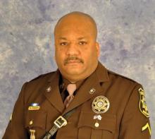 Formal portrait of man in Brown Maryland Sheriff's Uniform 2015