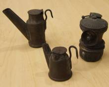 photograph of 3 antique mining lamps