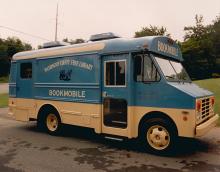 Smaller Bookmobile in 1985 parked on side of road