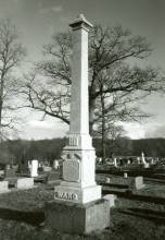 Grave marker like obelisk with Ward written at bottom in cemetery 
