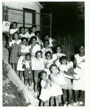 Children pose for picture on stairs outside of Pine Avenue circa ?