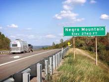 Photo from Interstate 68 of green Negro Mountain Elav 2740 ft sign