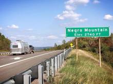 Photo from Interstate 68 of green Negro Mountain Elav 2740 ft sign