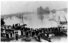 Potomac Edison power plant surrounded by water during 1936 Flood; onlookers gathered to view from land