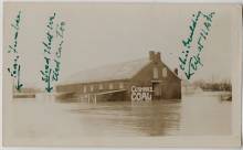 Photo of Cushwa warehouse surrounded by water during 1936 Flood; markings of building written on photo