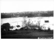 Photo of lockhouse from Lock No. 38 adrift in Potomac River; 1936 Flood