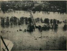 Aerial view of Hancock Bridge underwater during 1936 Flood