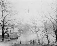 Black and white photo of flooded Lockhouse at Lock 44 & Power plant during 1936 Flood