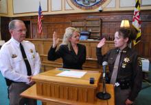 Photo in courthouse, man officer and 2 women; swearing in ceremony; Sheriff David Goad,  Circuit Court Clerk Dawne Lindsey, and Amanda Glass-Winner