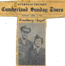 Newspaper clipping about Frostburg 'Angel'; man and woman in military uniform pose for picture