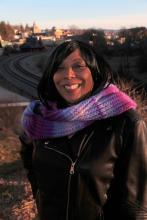 Photo of Kate Smith Brodie outside with purple scarf and black coat