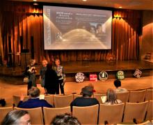 Photo of presenters and stage from Women's History Celebration 2019